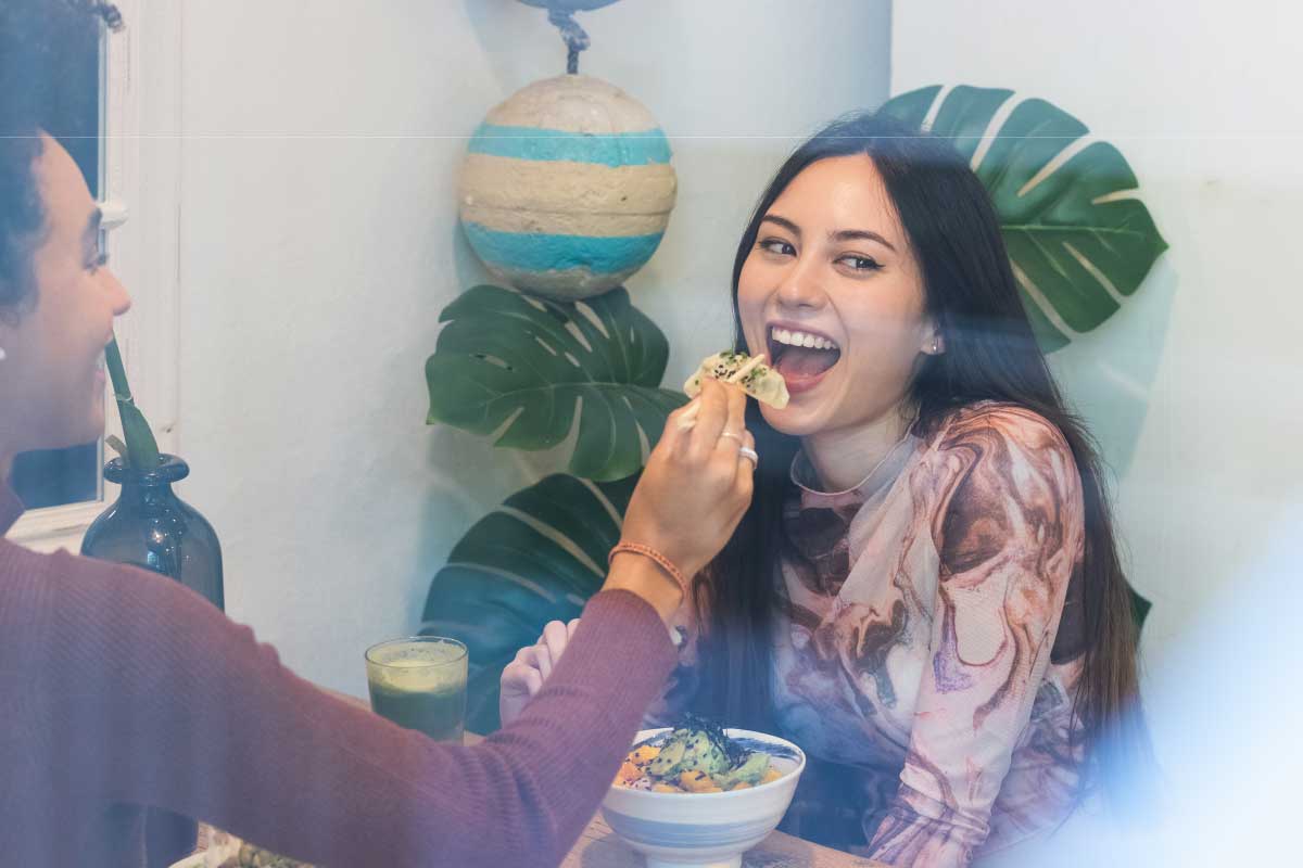 healthy asians eating hummus