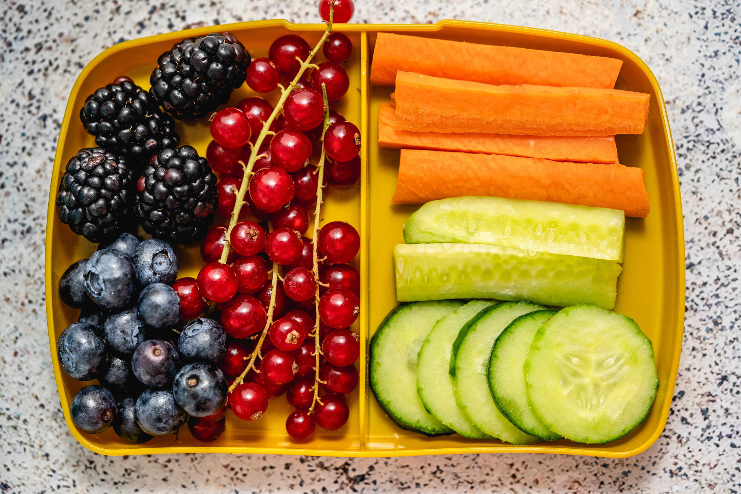 Healthy school lunch box with fresh vegetables and fruits. Top view flat lay