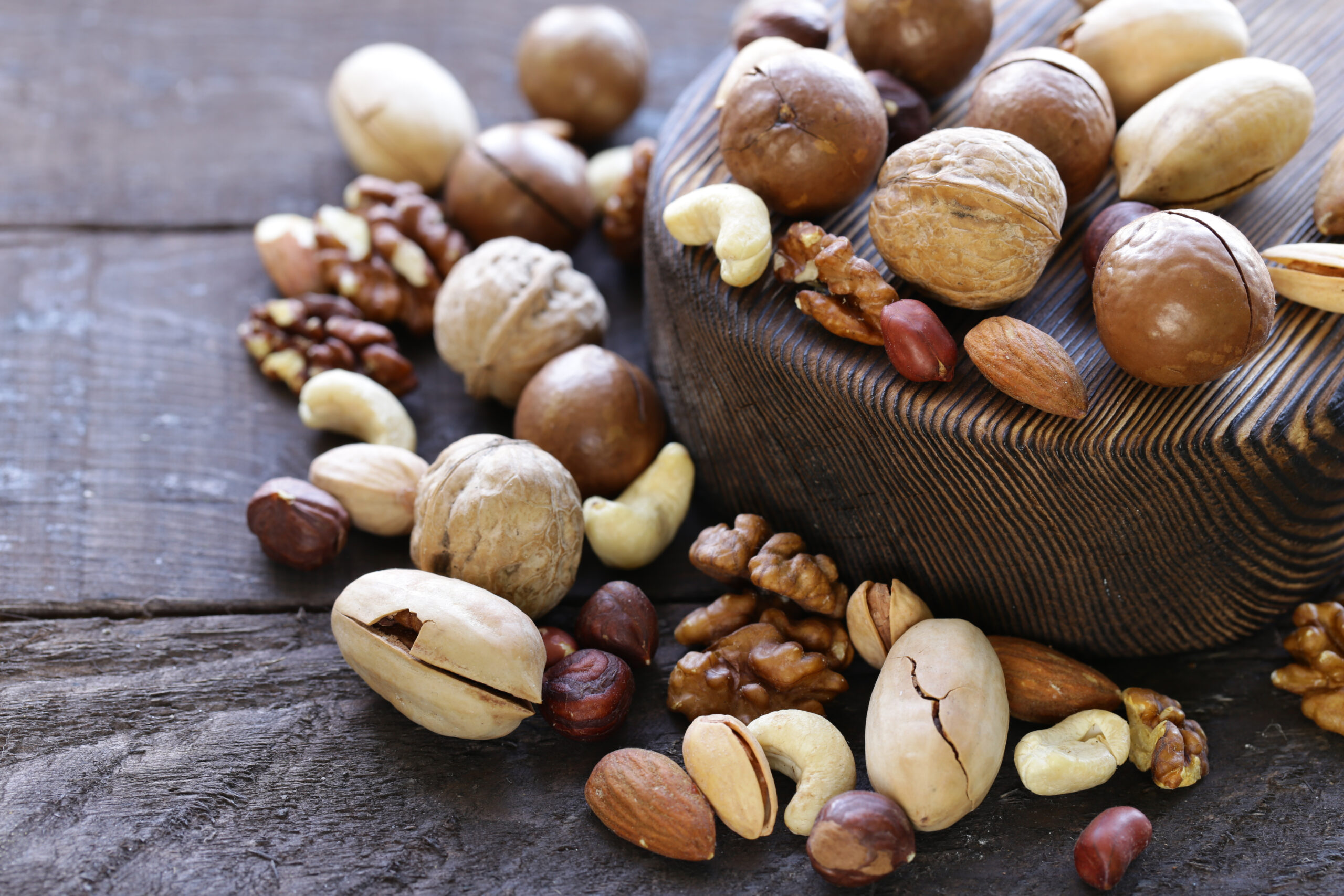 various nuts - macadamis, cashews, almonds and walnuts