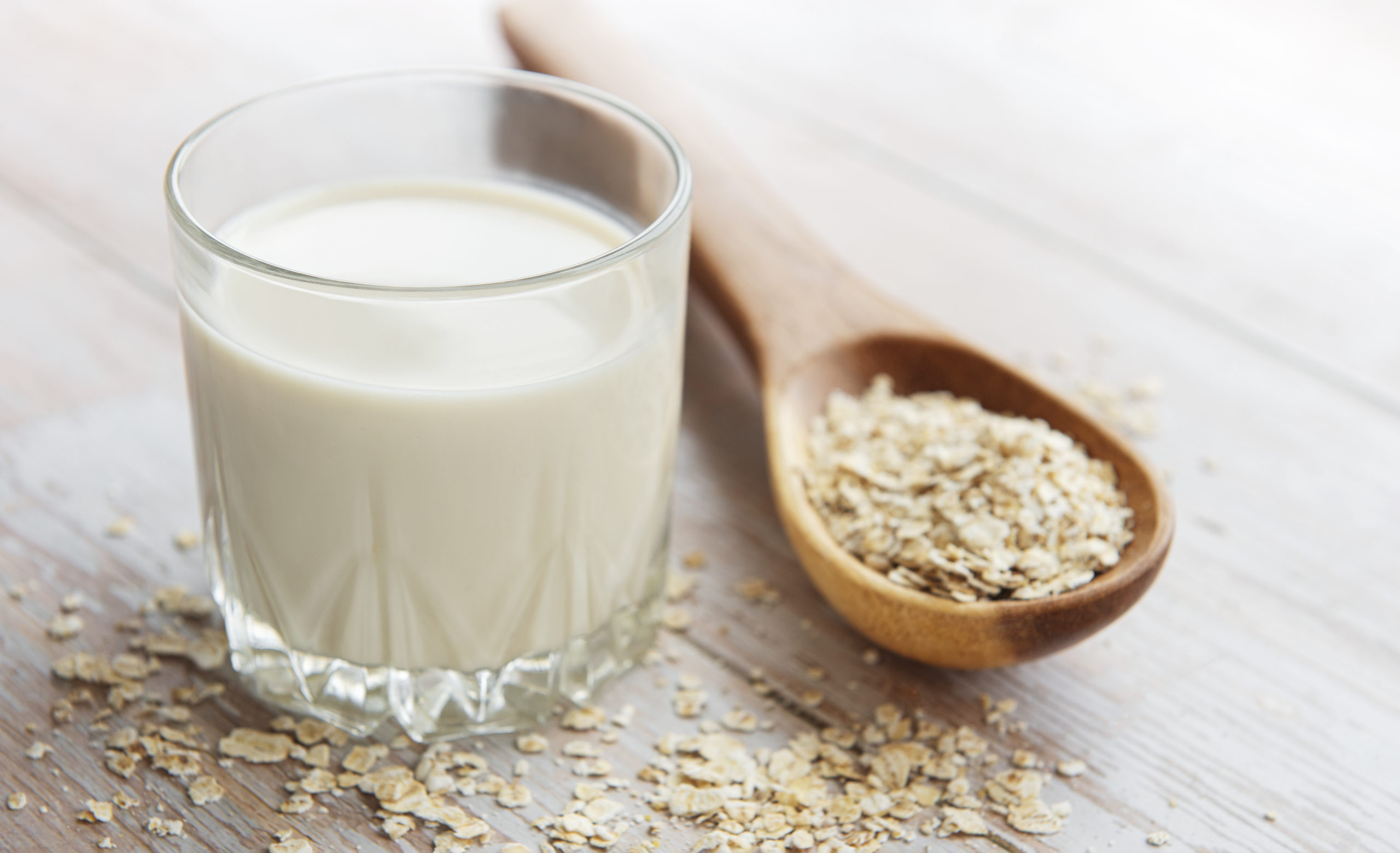 Vegan non dairy alternative milk. Oat flakes milk